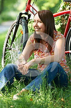 Middle Aged Woman On Cycle Ride In Countryside