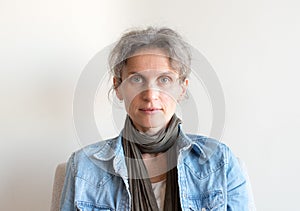 Middle aged woman in denim shirt