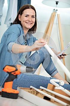 middle aged woman doing diy at home
