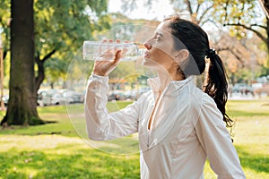 Middle-Aged Woman Drinking Water After Workout