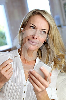 Middle-aged woman with earphones