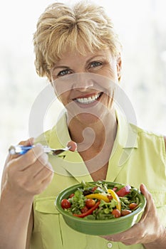 Middle Aged Woman Eating Fresh Salad