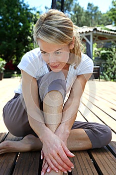 Middle-aged woman excercising outdoors