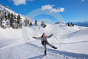 middle-aged woman has fun winter hiking in rofan