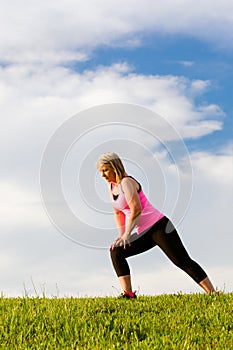 Middle-aged woman in her 40s stretching photo