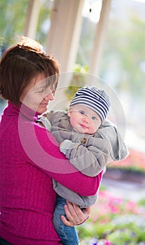 Middle aged woman and her little grandson