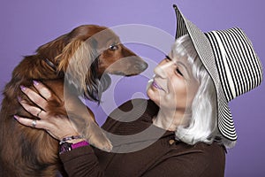 Middle-aged woman holding a dog