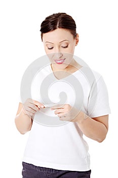 Middle aged woman holding a pregnancy test
