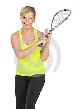 Middle aged woman holding squash racket