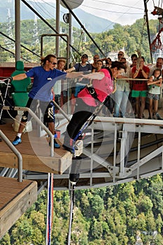 A middle-aged woman jumping with bungee, jump from a height of 69 metres from a special platform, which is located at the bridge S