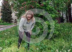 Middle-aged woman, laughing cheerfully, pretty, positive, cheerfu