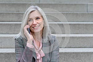 Middle-aged woman listening to a phone call