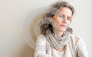 Middle aged woman looking pensive