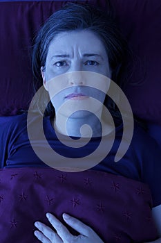 Woman awake bed night insomnia photo