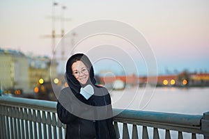 Middle aged woman on the Neva embankment in St. Petersburg, Russia