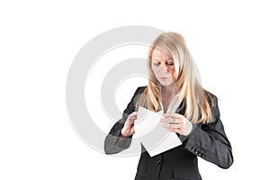 Middle aged woman opens a letter photo