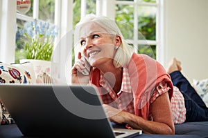 Middle Aged Woman Ordering Item On Telephone