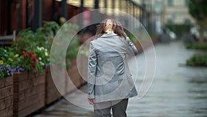 Middle-aged woman with osteochondrosis is wearing neck brace for curing and relieving neck pain