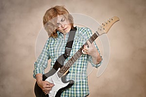 Middle aged woman playing electric guitar