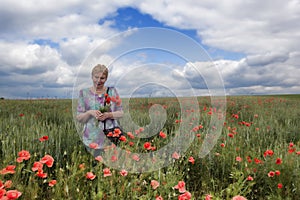 Middle-aged woman on a poppy field