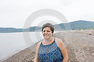 Middle aged woman portrait on the beach
