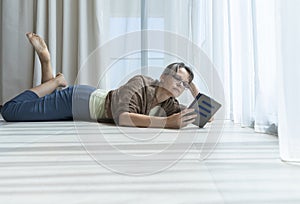 Middle aged woman reading a book