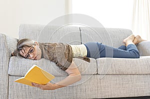 Middle aged woman reading a book