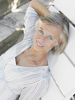 Middle Aged Woman Reclining On Sunlounger
