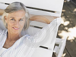 Middle Aged Woman Reclining On Sunlounger photo