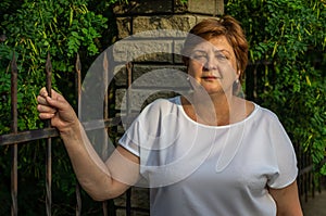 Middle-aged woman resting in the city Park