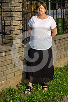 Middle-aged woman resting in the city Park