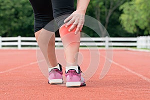 Middle aged woman runner muscle pain.