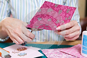 Middle Aged Woman Scrapbooking At Home