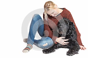 Middle aged woman sitting with the Schnauzer dog