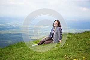 Middle aged woman on the slope of volcano