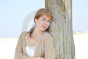 Middle aged woman standing at the beach