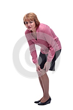 Middle aged woman suffering from knee pain, joint injury or arthritis