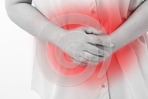 Middle aged woman suffering from stomach ache, belly pain