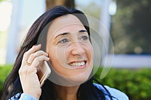 Middle aged woman talking on phone