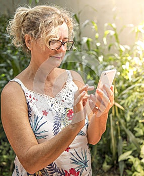 Middle aged woman using cellphone