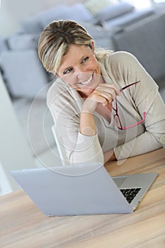 Middle-aged woman using computer