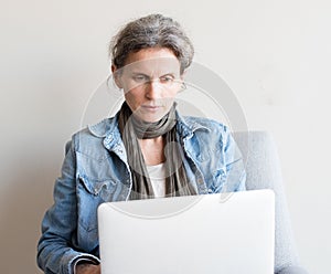 Middle aged woman using computer