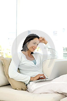 Middle-aged woman using laptop