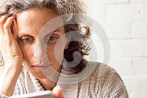 Middle aged woman using phone