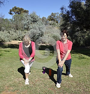 Middle-aged Women Stretching Legs Before Exercise.