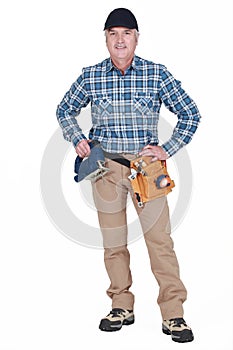 Middle-aged worker with band-saw inside