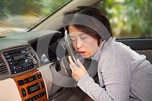 Middle Asian adult sleepy behind steering wheel. Concept of risk in transport accident