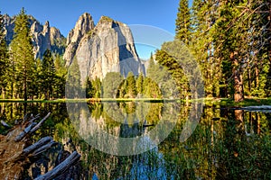 Middle Cathedral Rock reflecting in Merced River at Yosemite