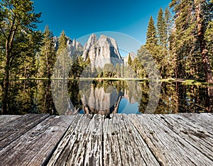 Middle Cathedral Rock reflecting in Merced River at Yosemite