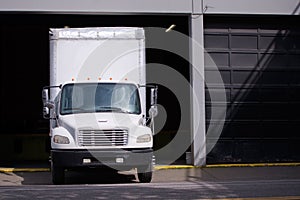 Middle class semi truck with box trailer for moving services sta